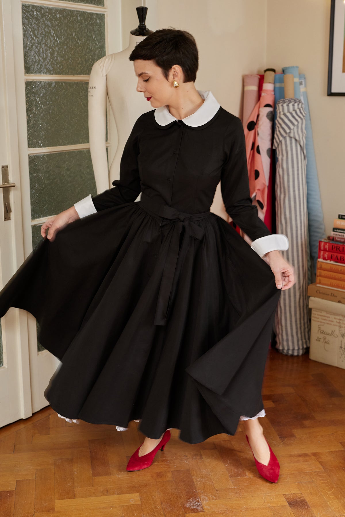 Milla Milla midi dress with floral print on black background – limited edition, available by pre-order only