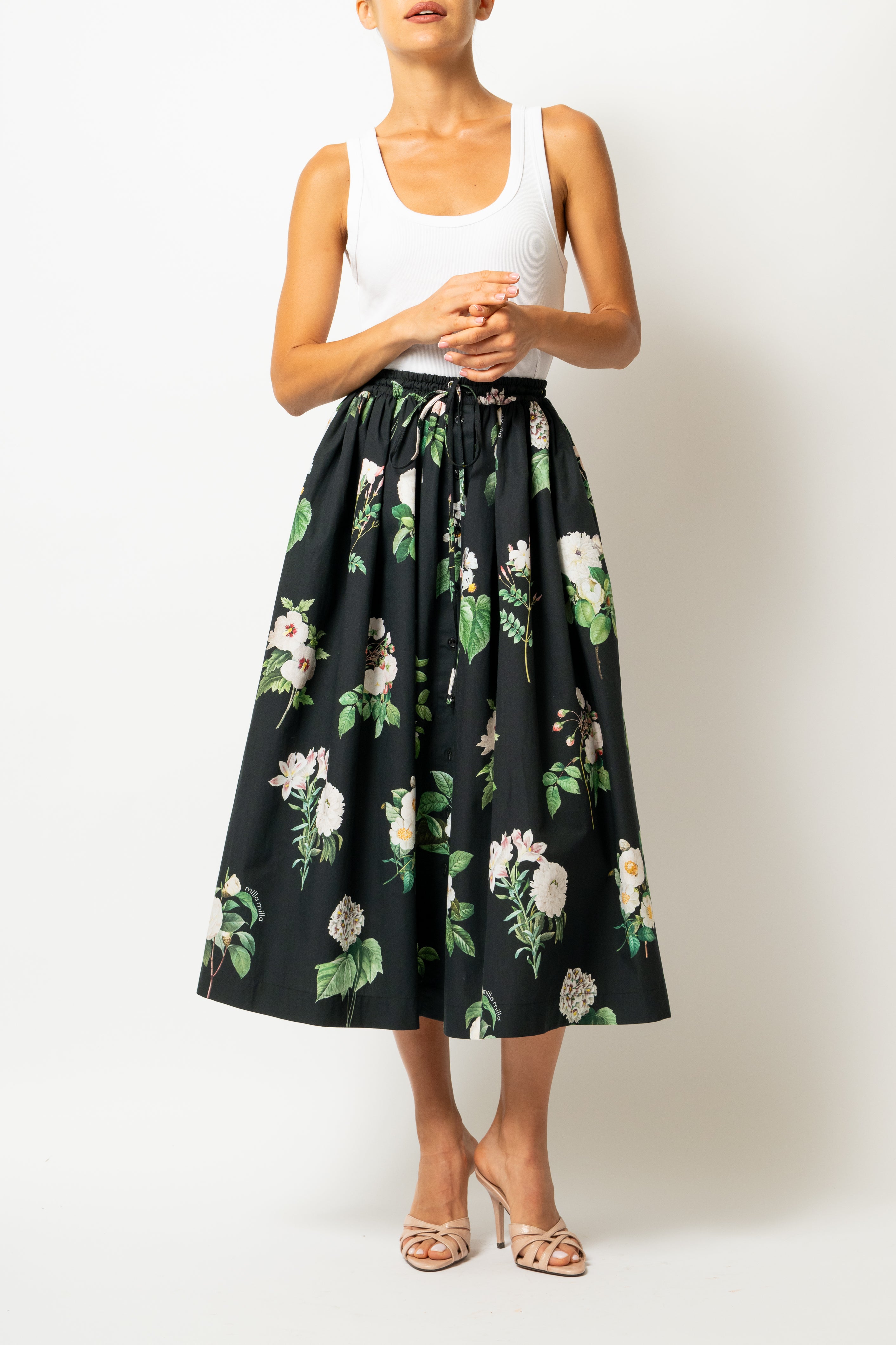 White linen midi skirt with ruffles and crocheted lace