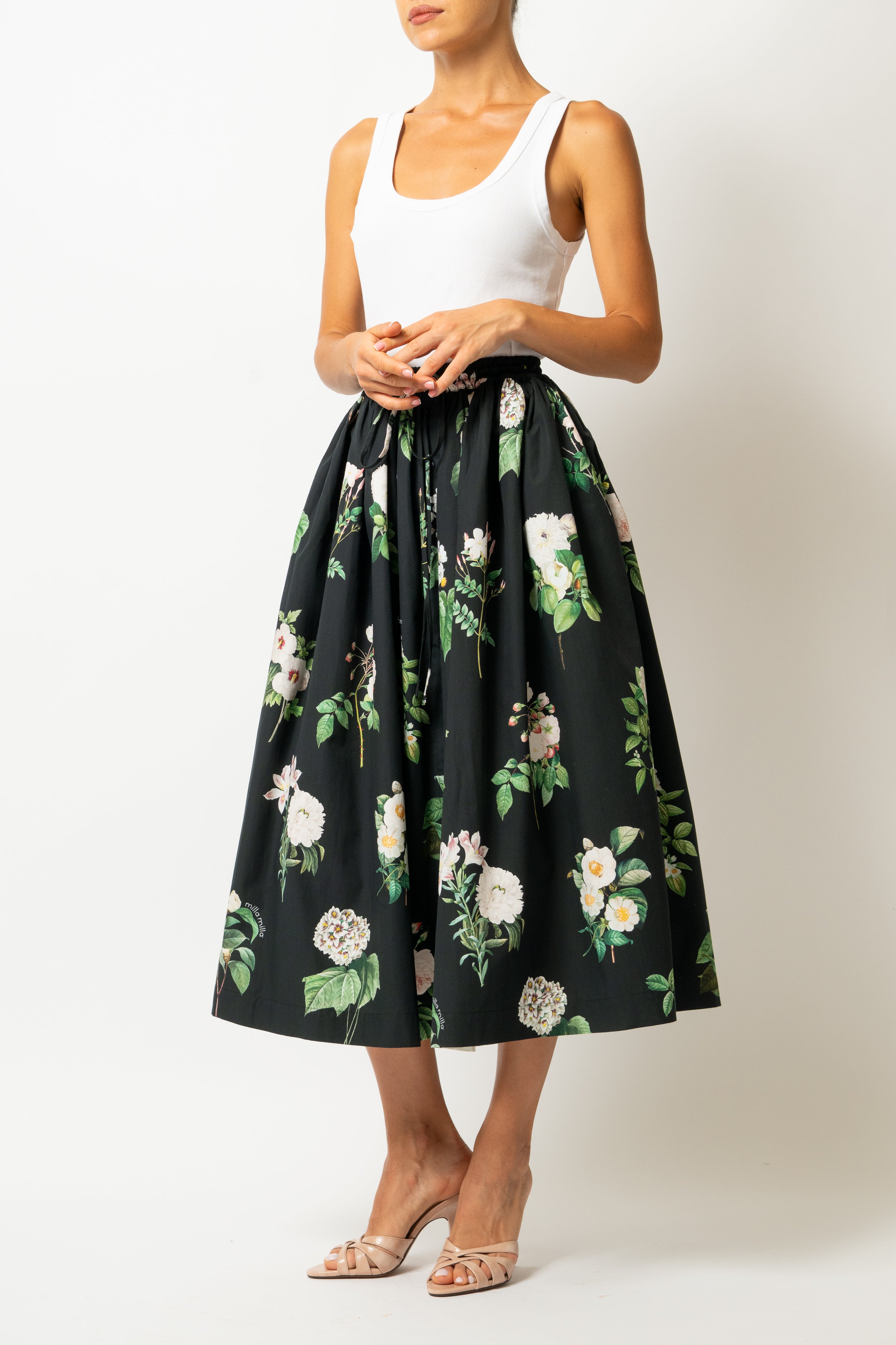 White linen midi skirt with ruffles and crocheted lace