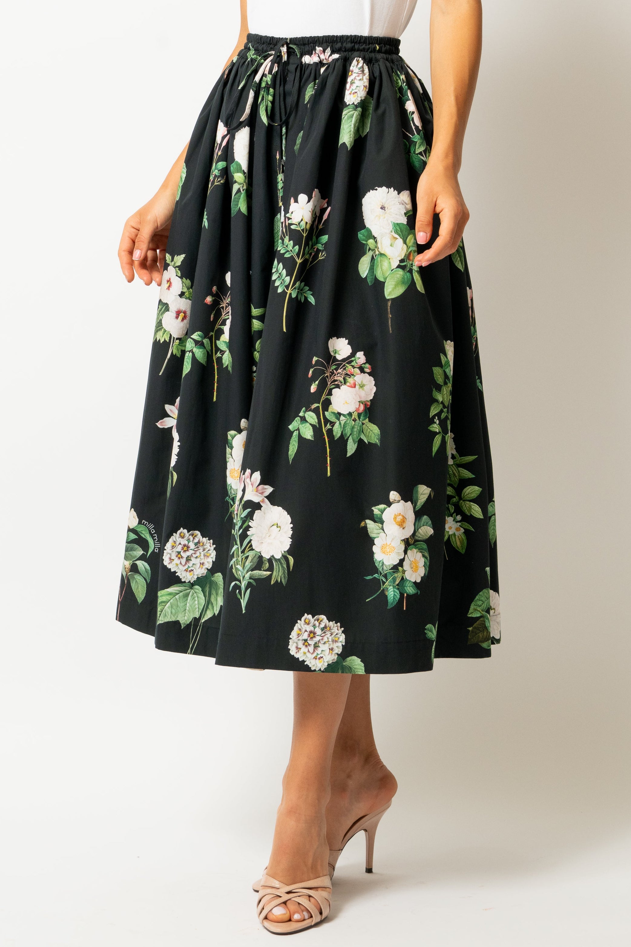 White linen midi skirt with ruffles and crocheted lace