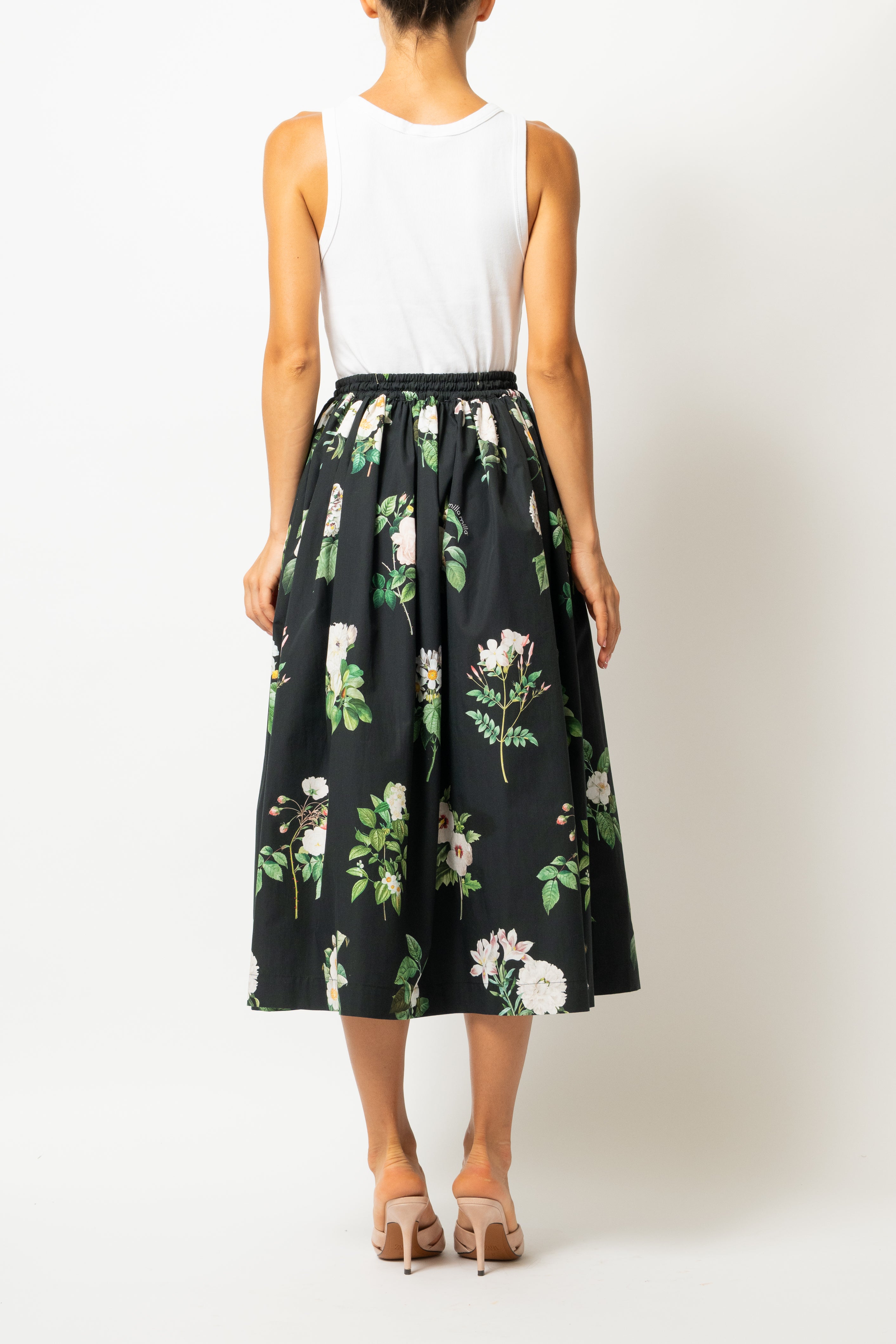 White linen midi skirt with ruffles and crocheted lace