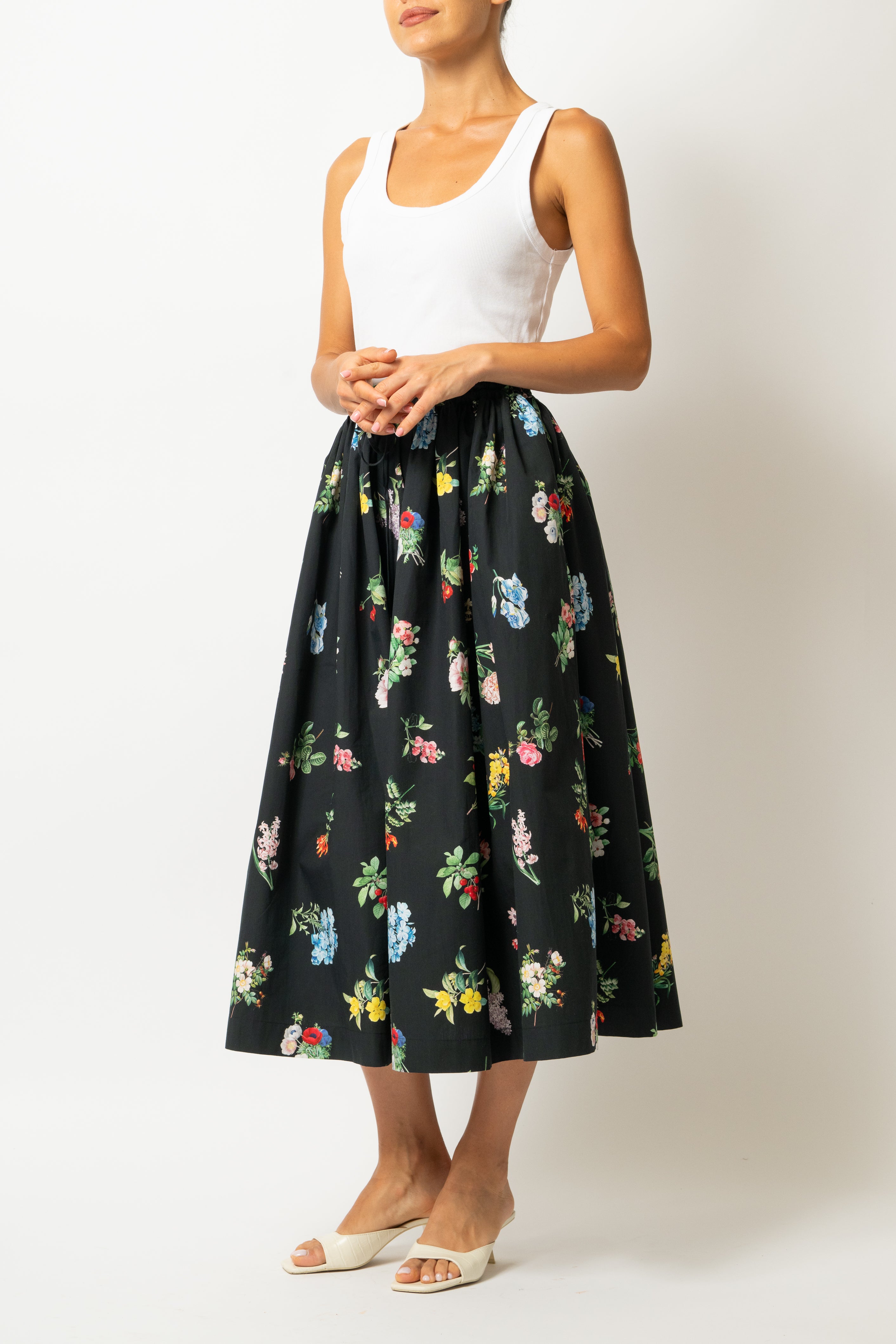 White linen midi skirt with ruffles and crocheted lace