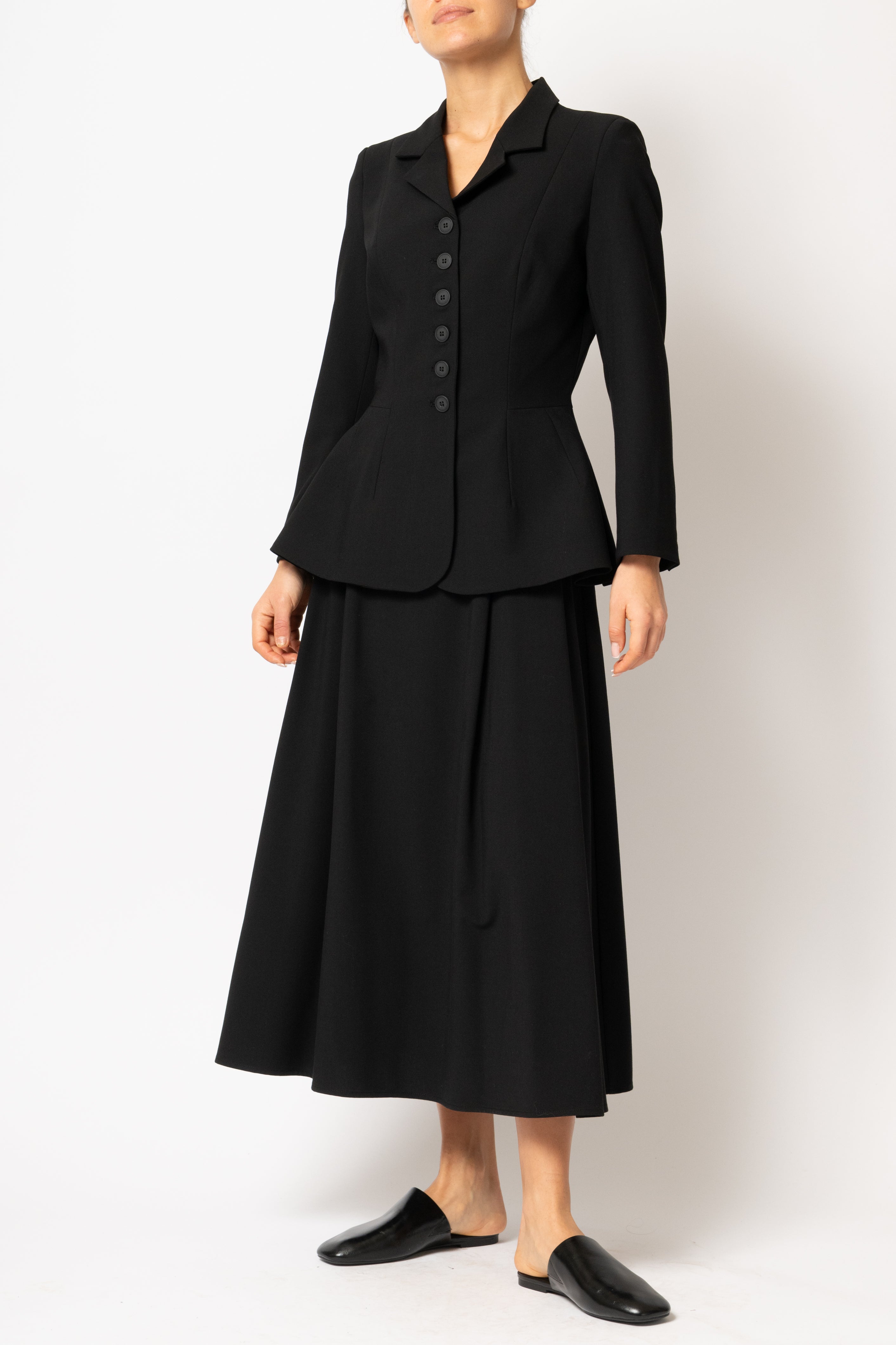 Wide pleated midi skirt made of black viscose fabric