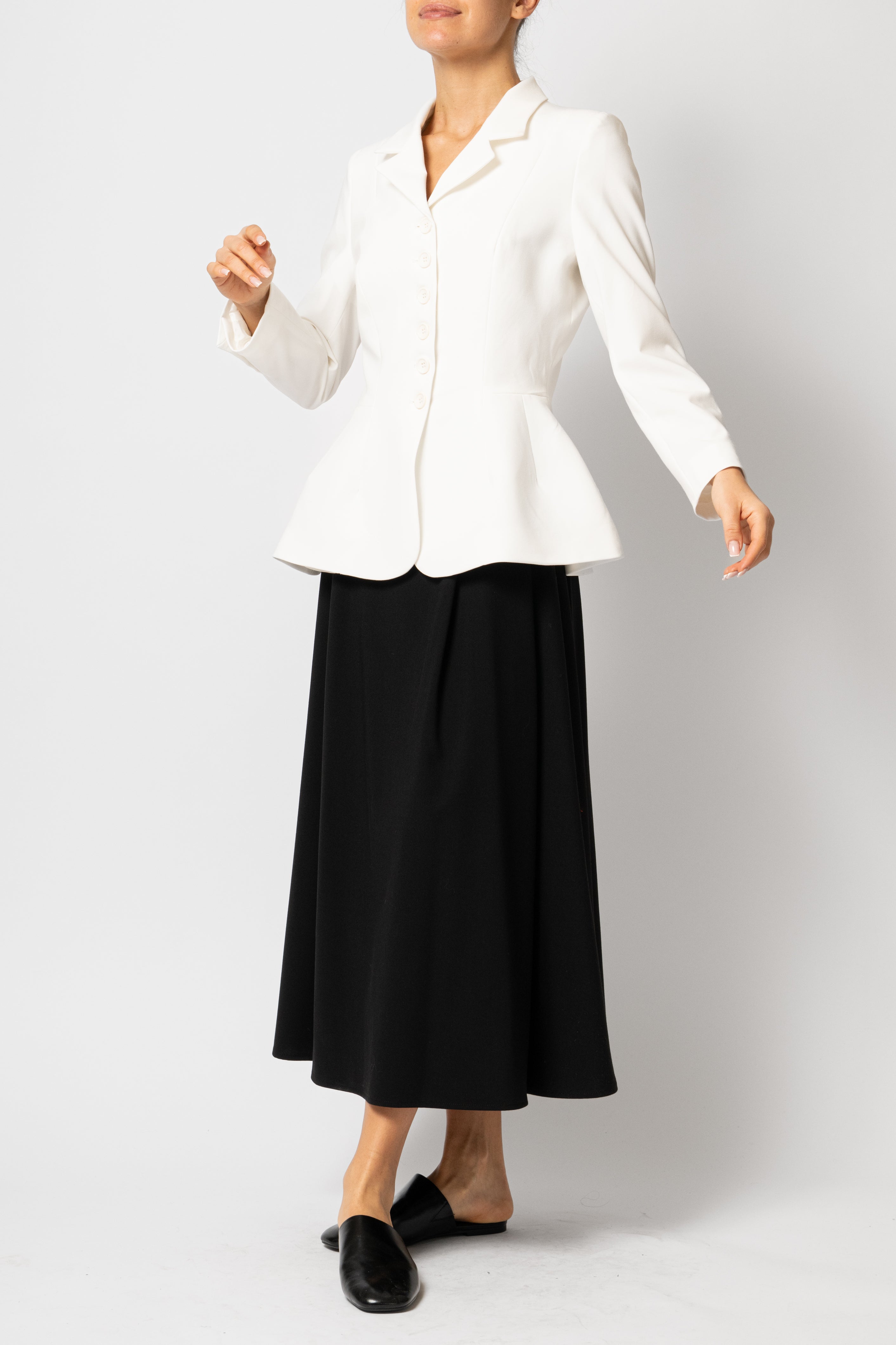 Wide pleated midi skirt made of black viscose fabric