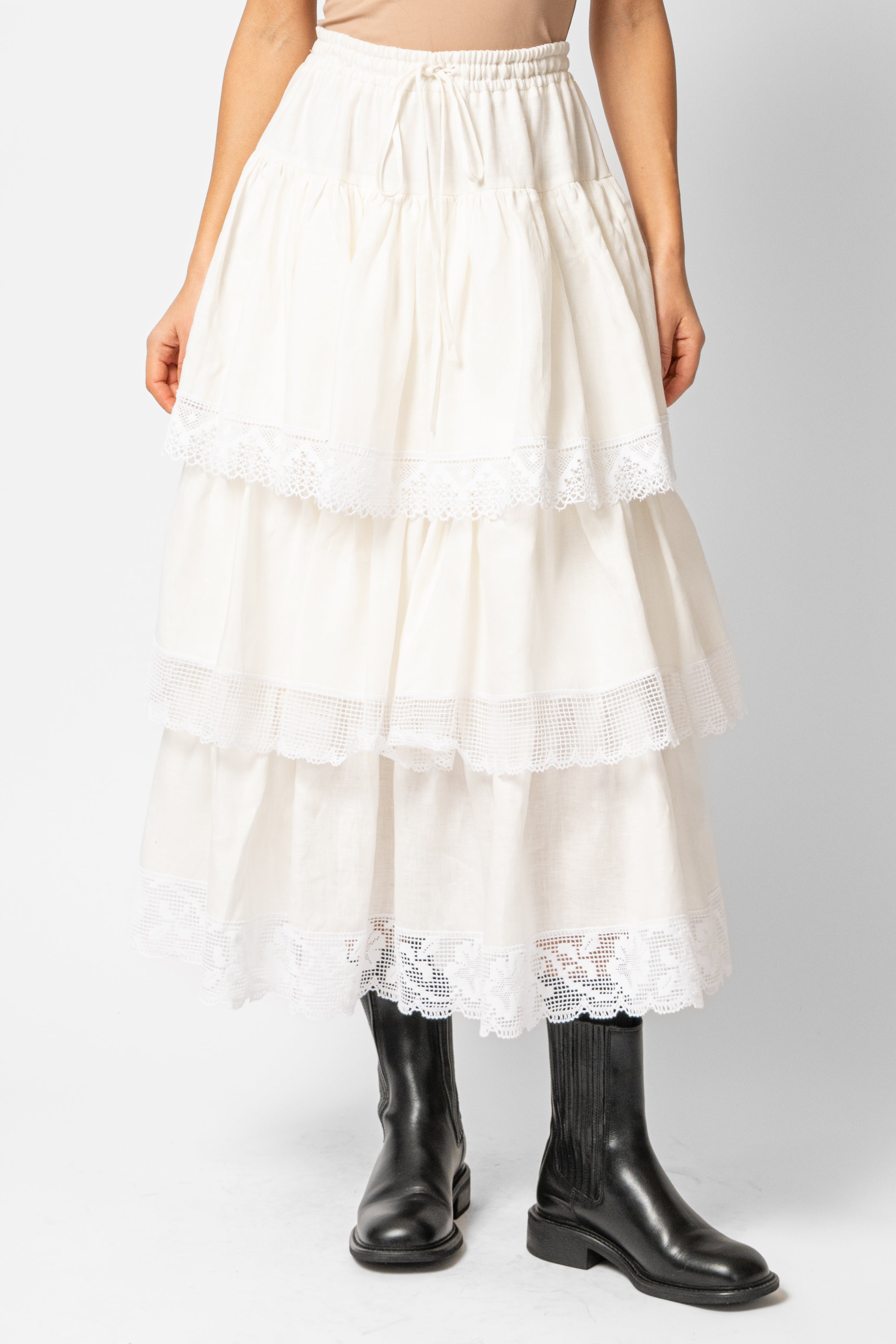 White linen midi skirt with ruffles and crocheted lace