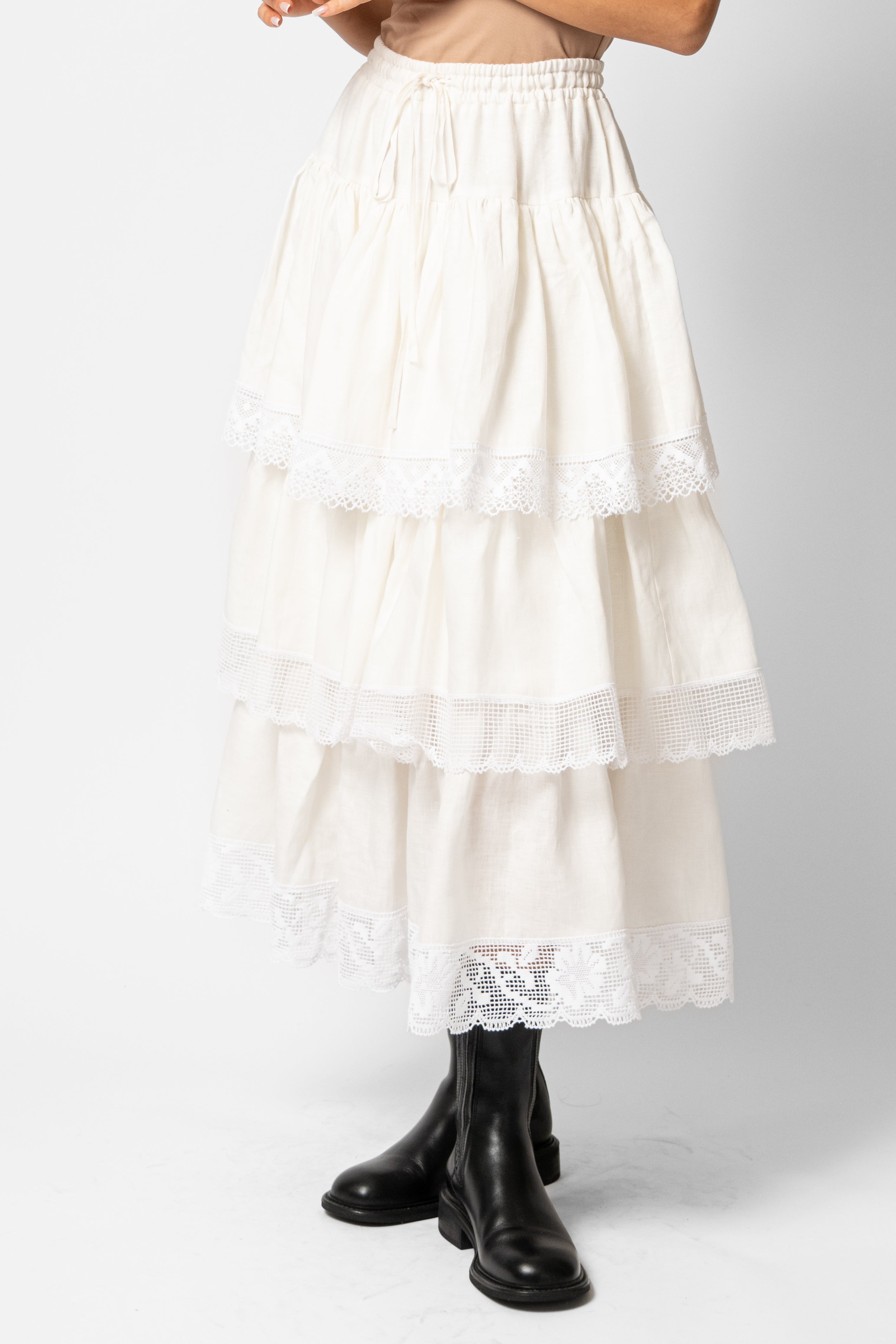 White linen midi skirt with ruffles and crocheted lace