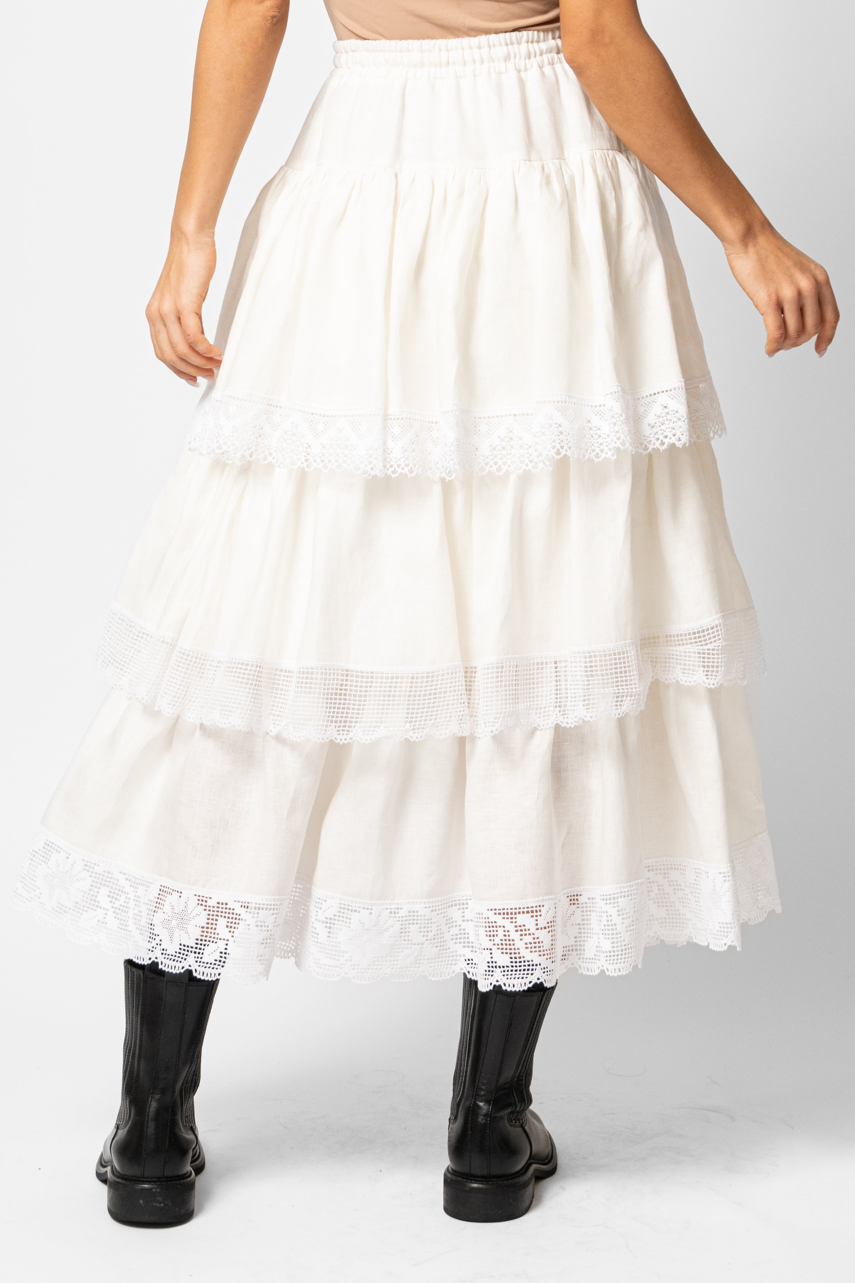 White linen midi skirt with ruffles and crocheted lace