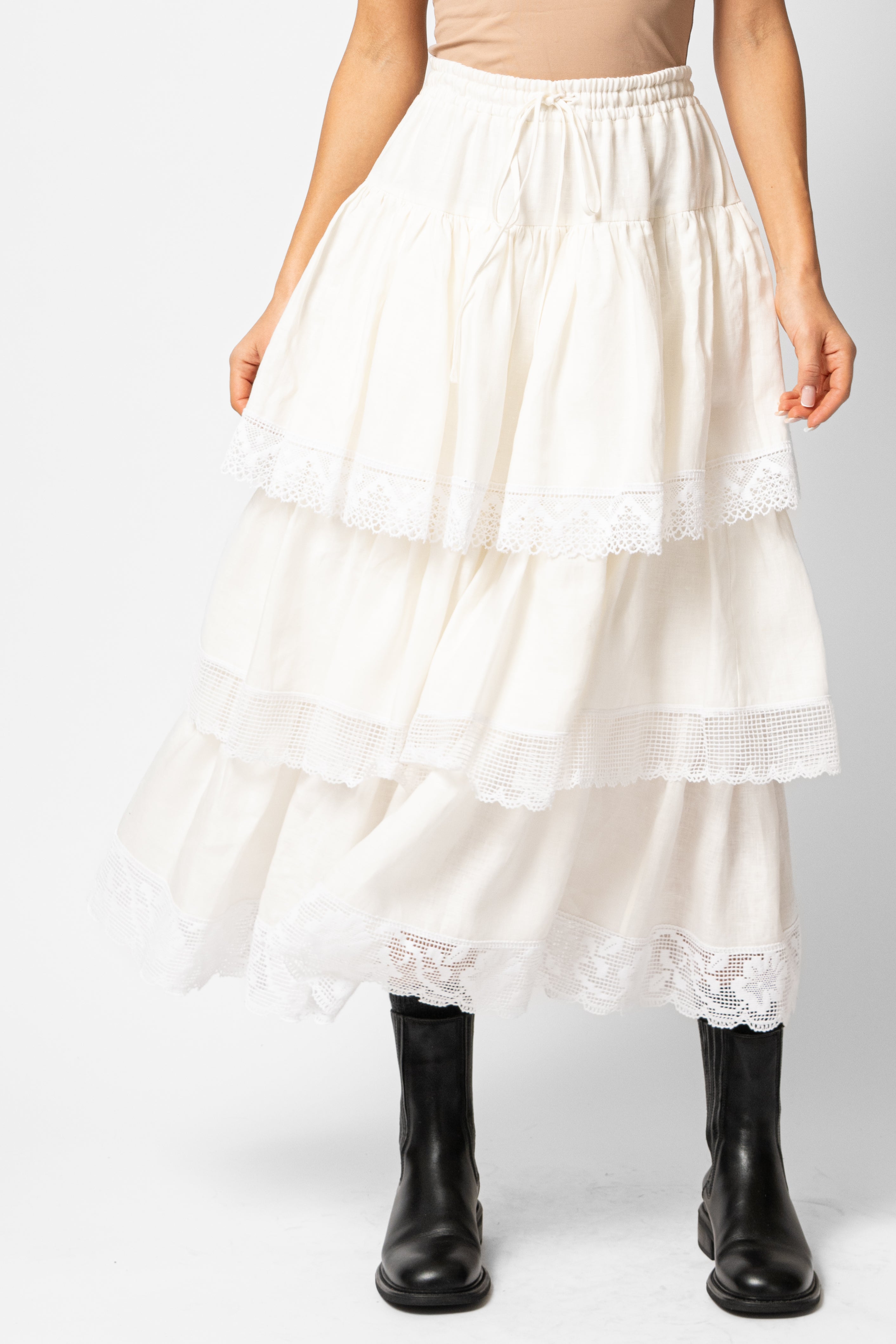 White linen midi skirt with ruffles and crocheted lace