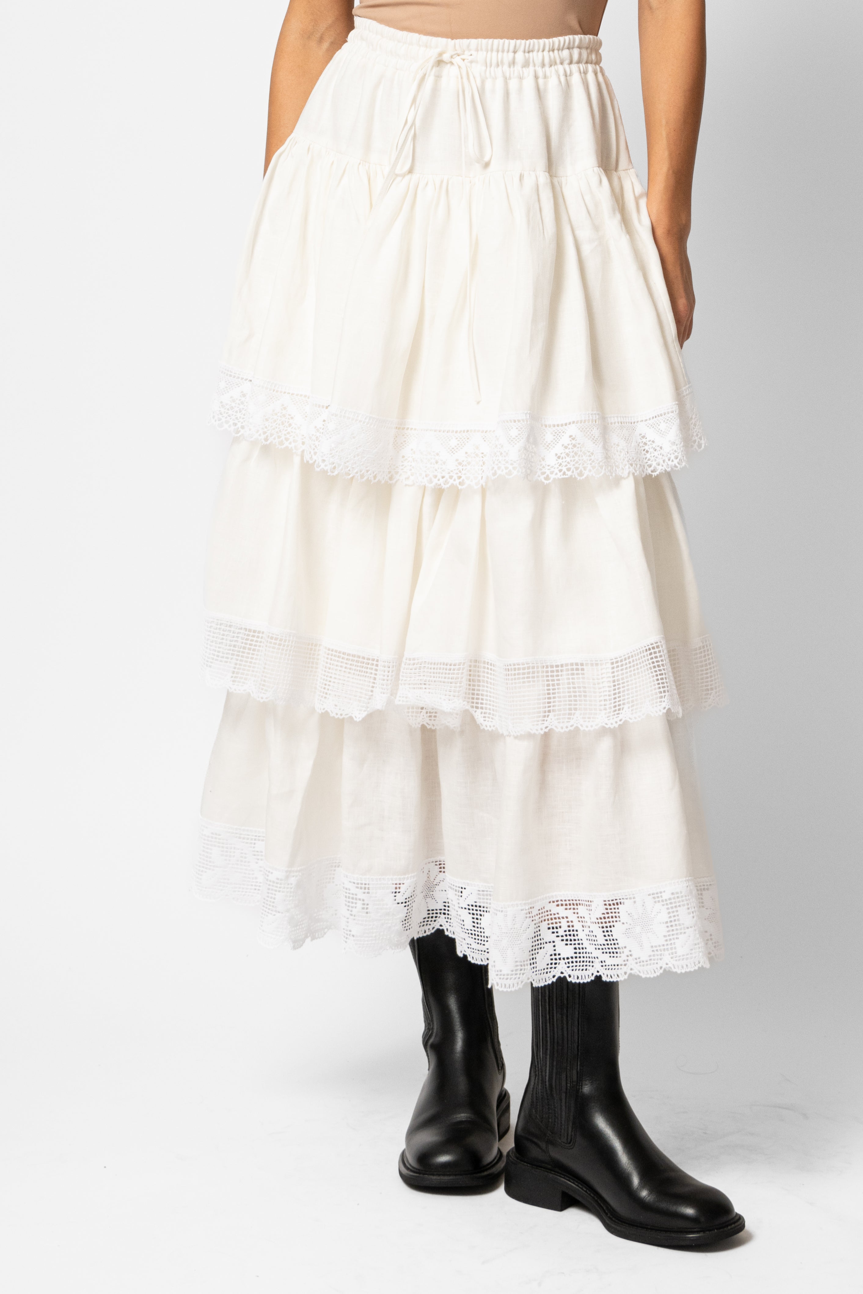 White linen midi skirt with ruffles and crocheted lace