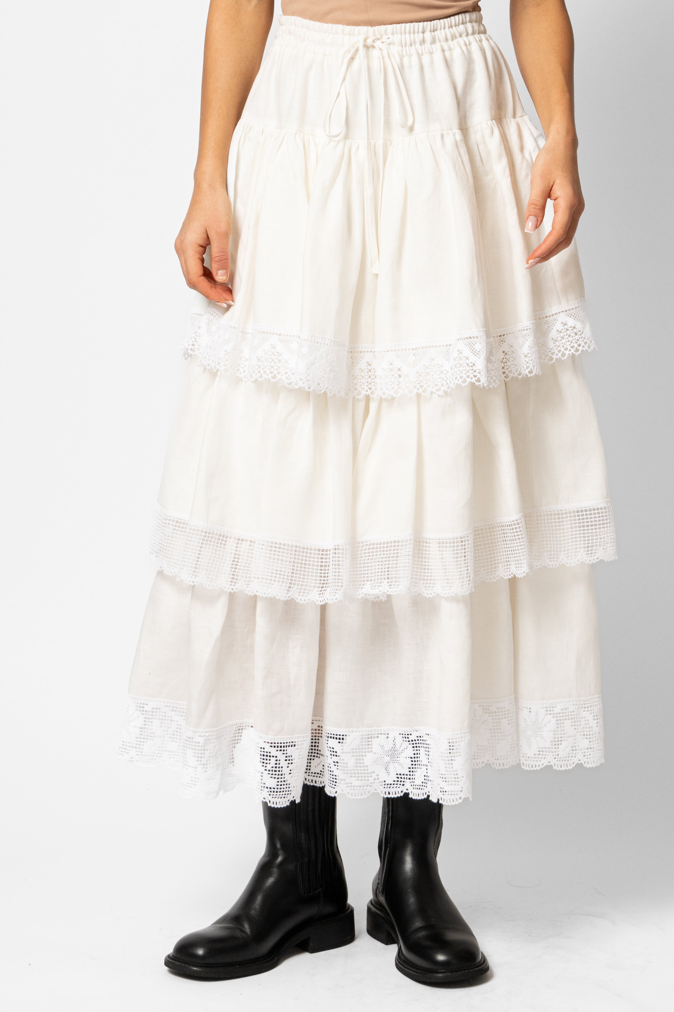 White linen midi skirt with ruffles and crocheted lace