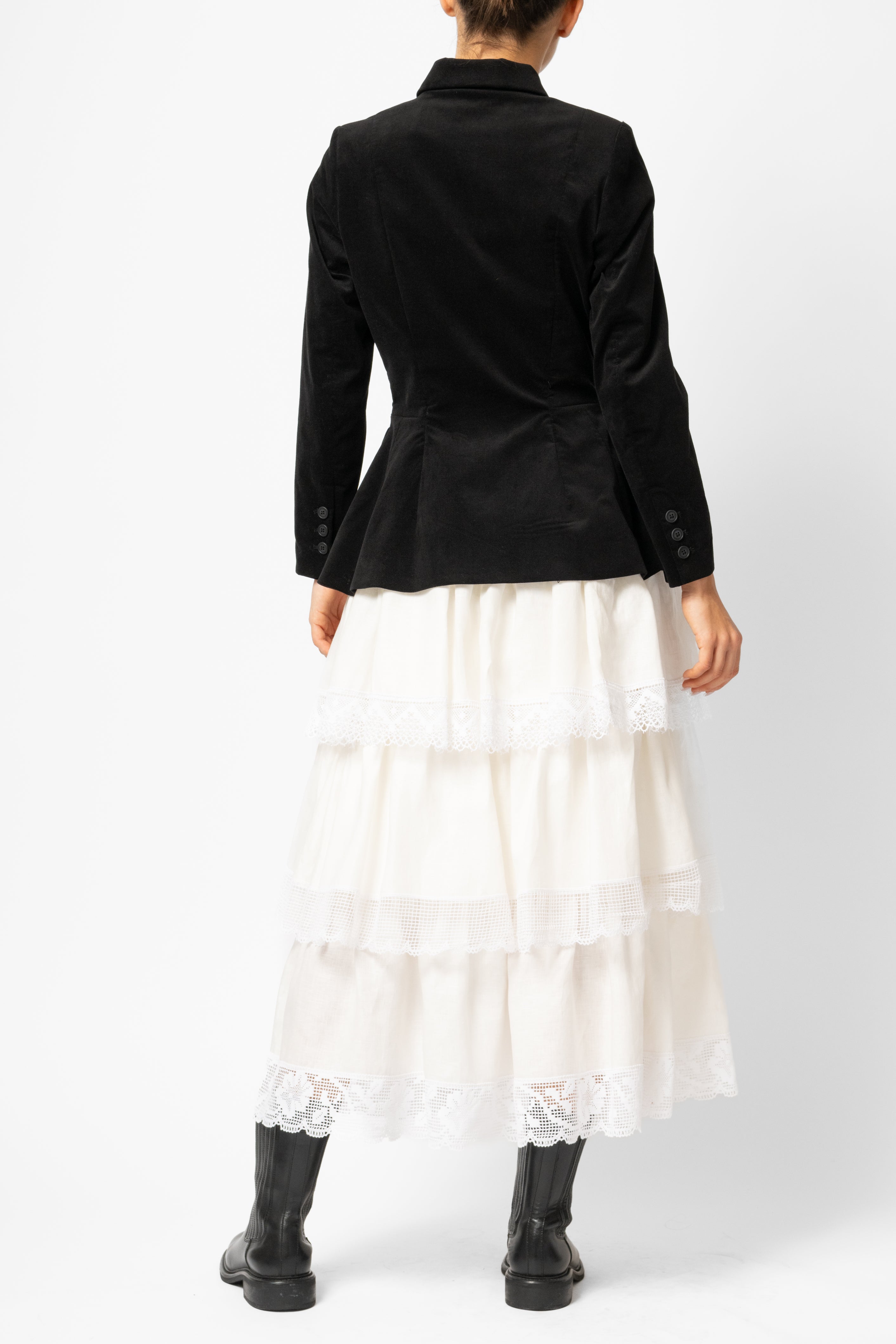 White linen midi skirt with ruffles and crocheted lace