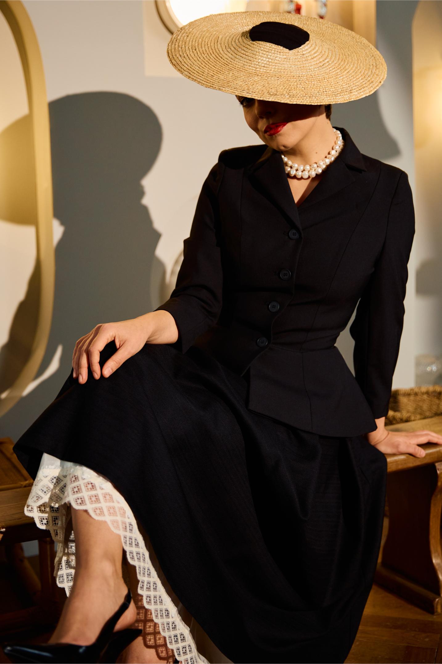 Wide midi skirt made of black wool fabric with ecru lace