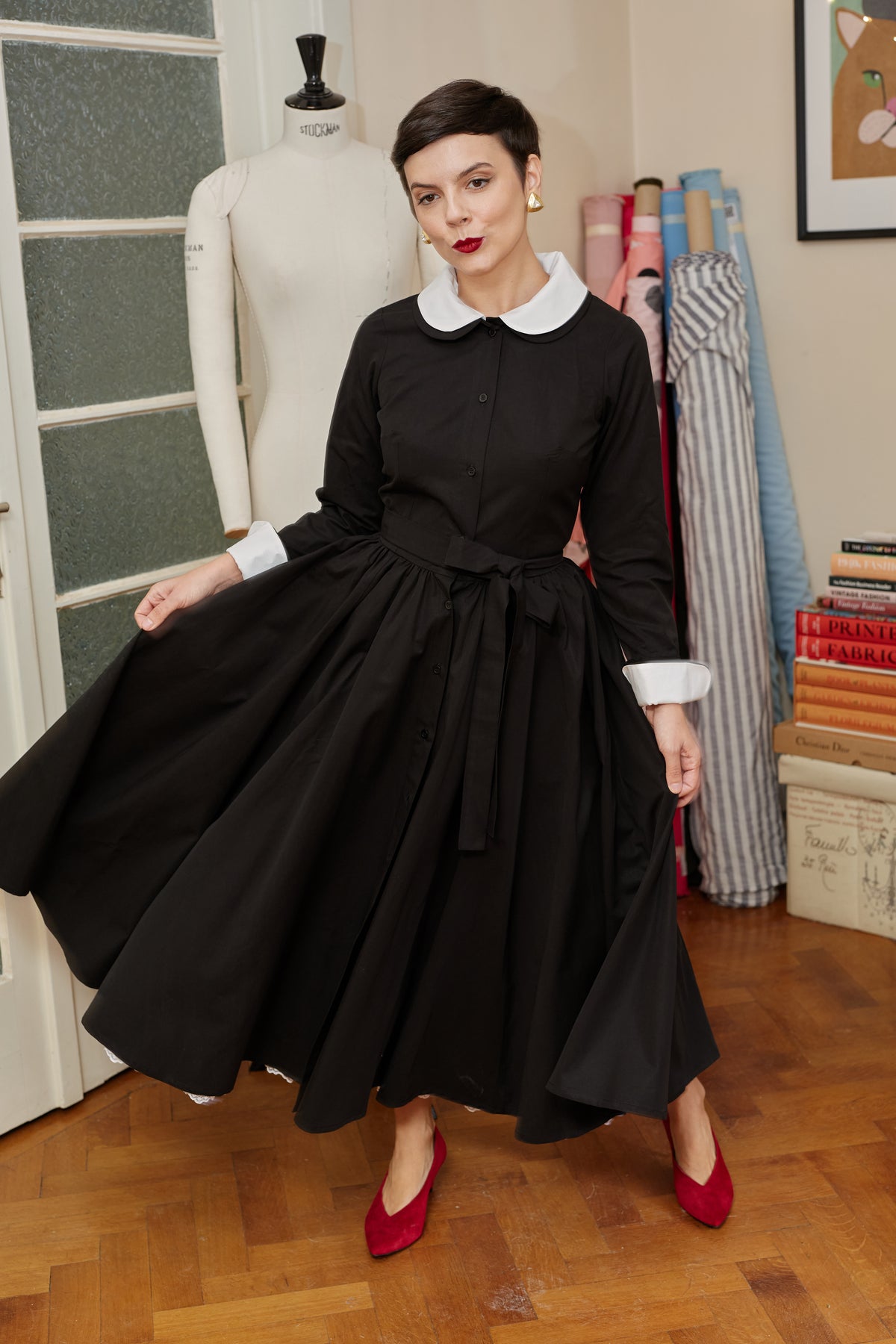 Milla Milla midi dress with floral print on black background – limited edition, available by pre-order only