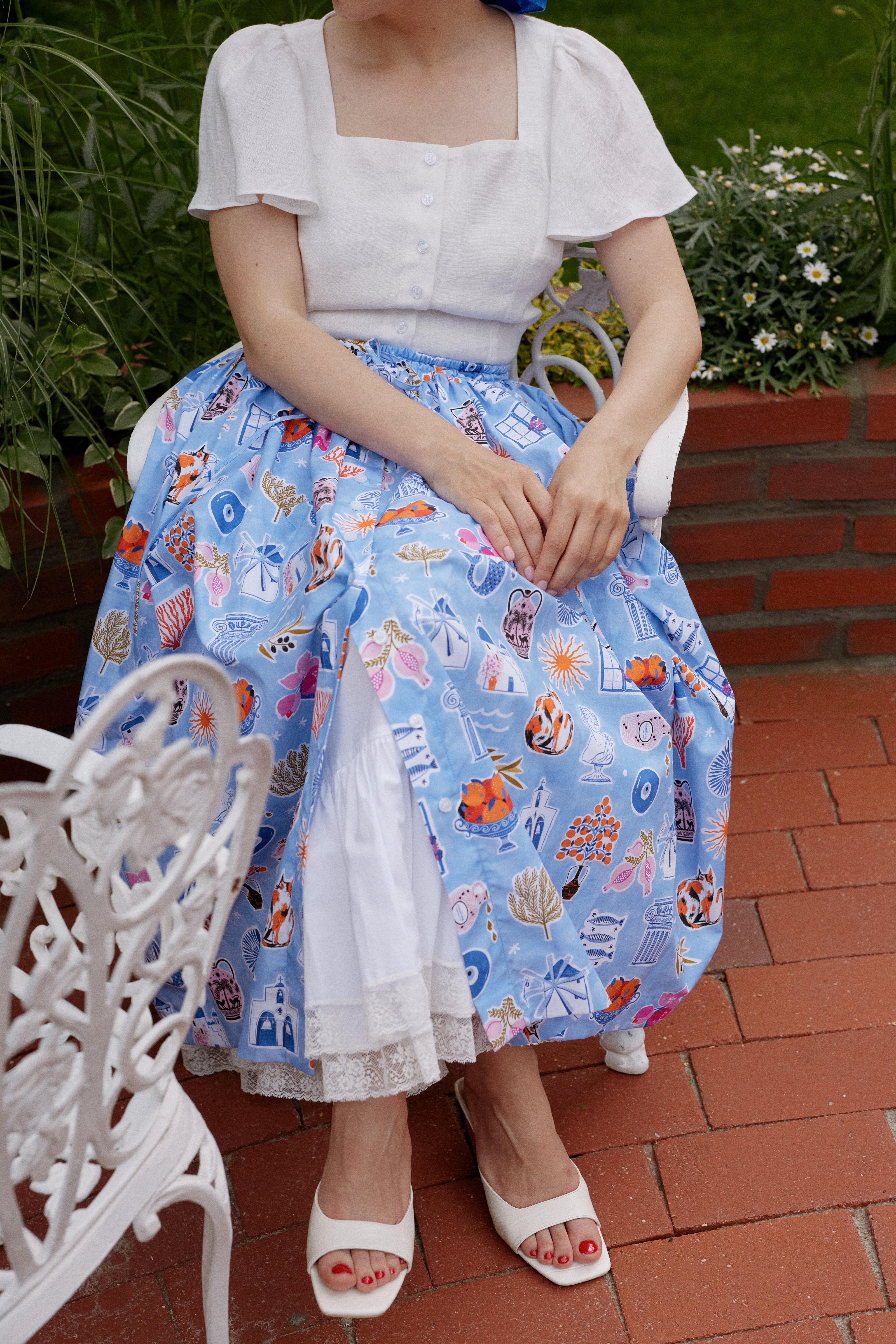 White linen midi skirt with ruffles and crocheted lace