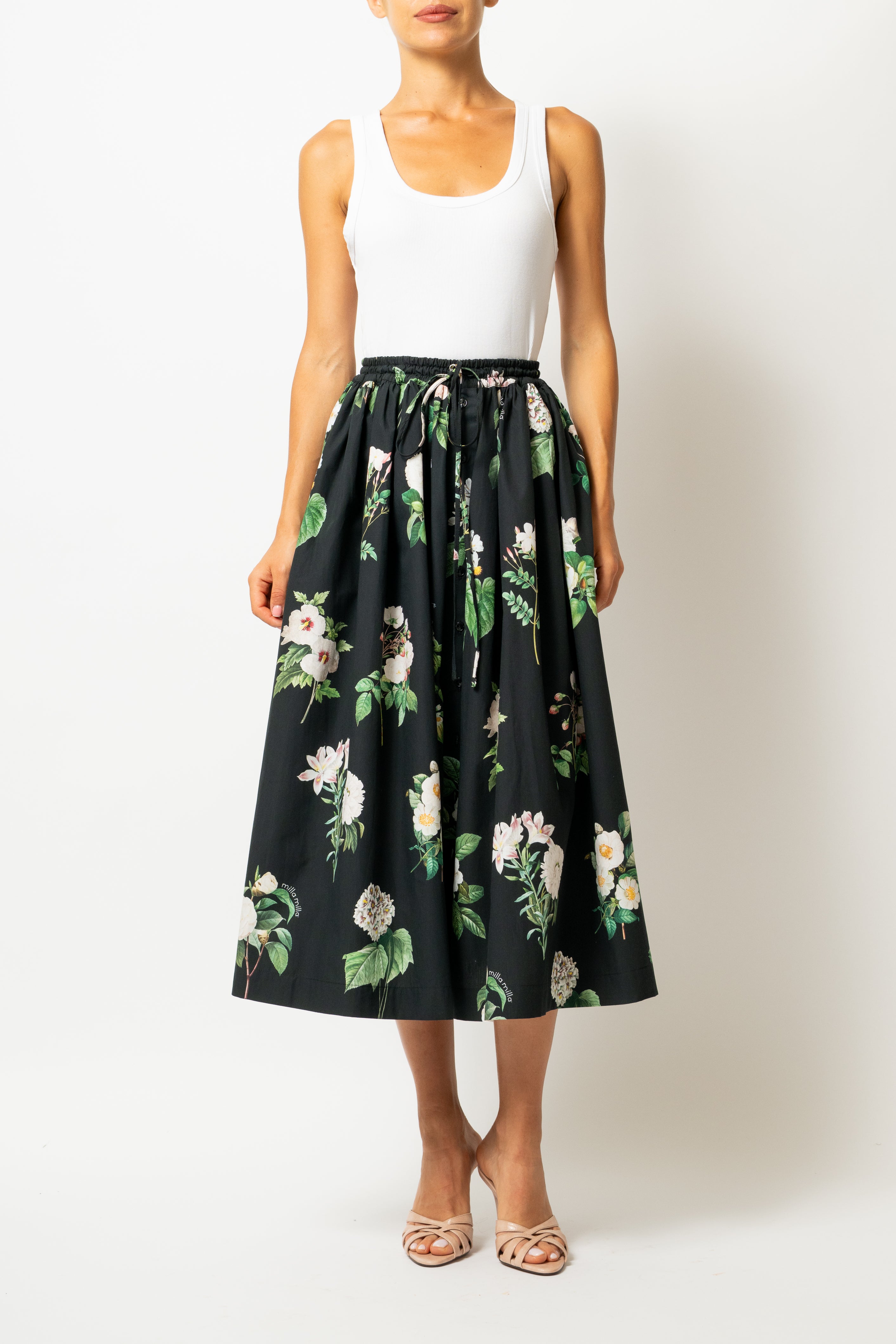 White linen midi skirt with ruffles and crocheted lace