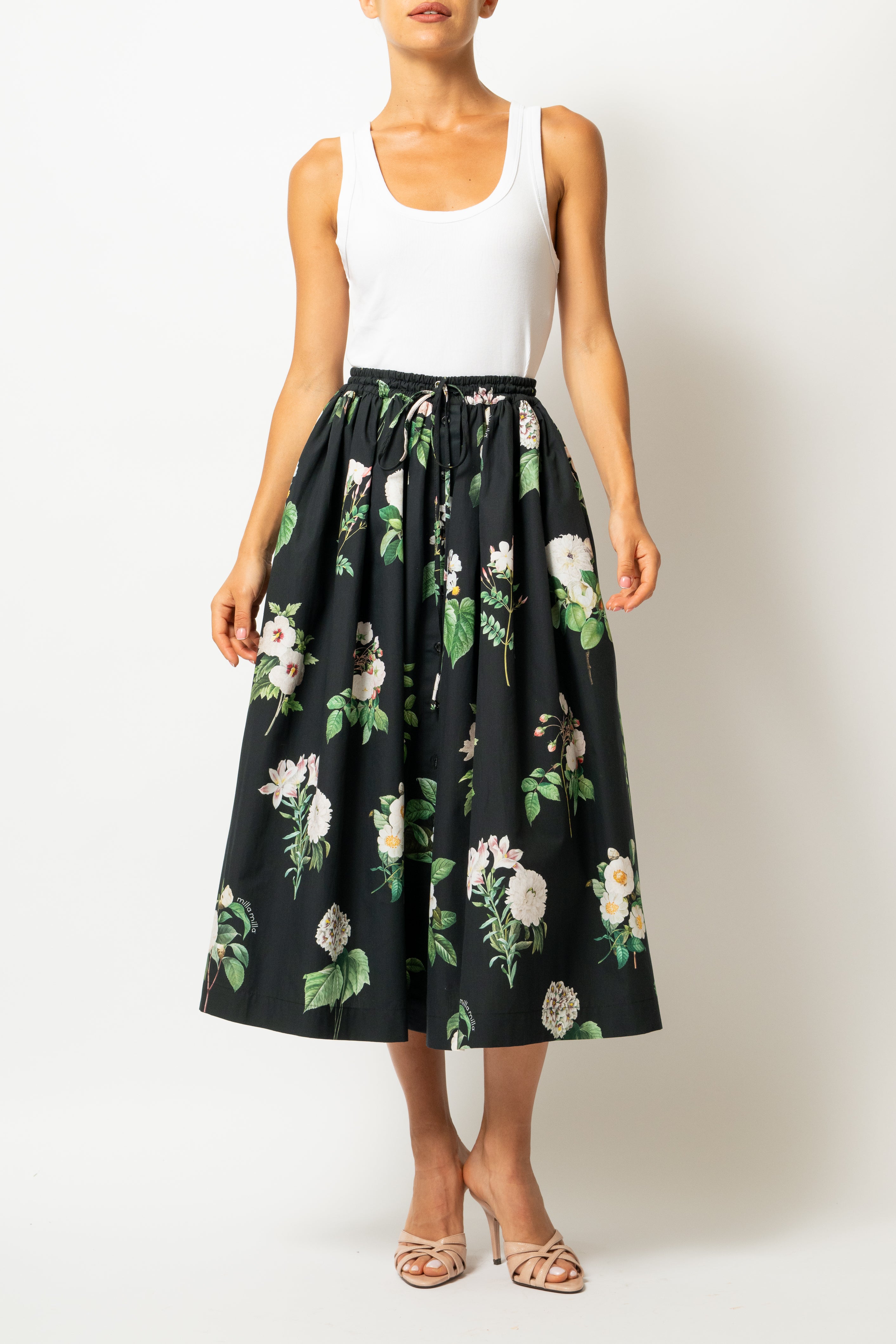 White linen midi skirt with ruffles and crocheted lace