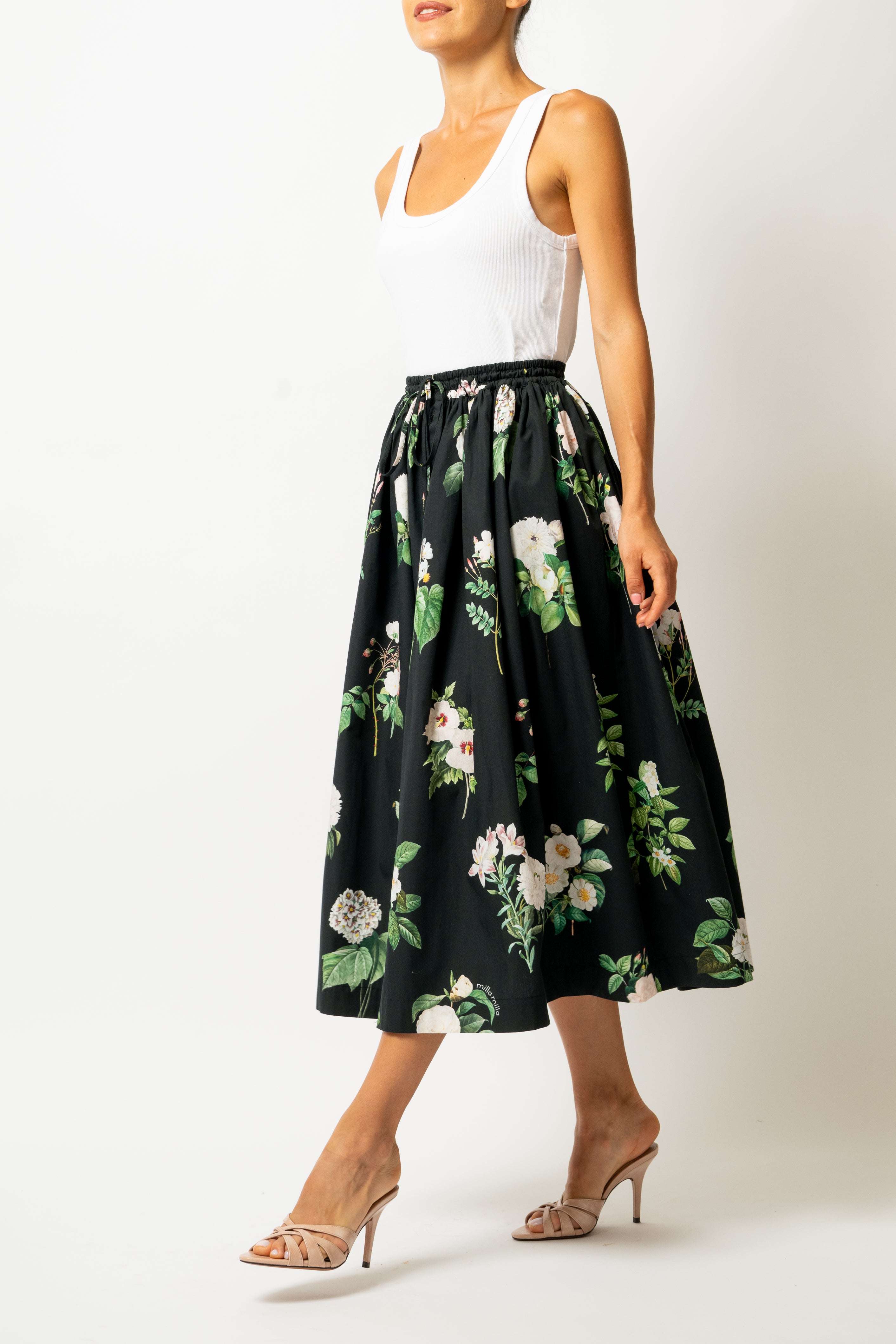 White linen midi skirt with ruffles and crocheted lace
