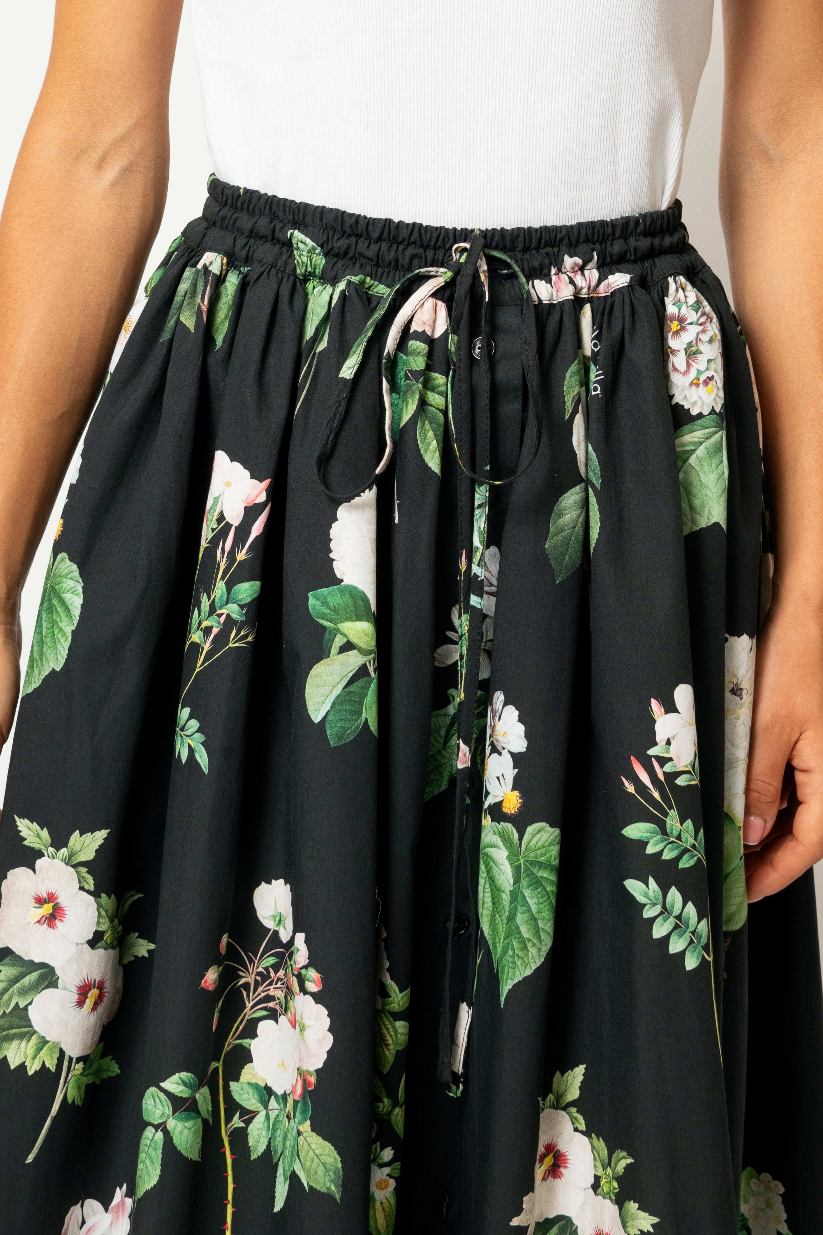 White linen midi skirt with ruffles and crocheted lace