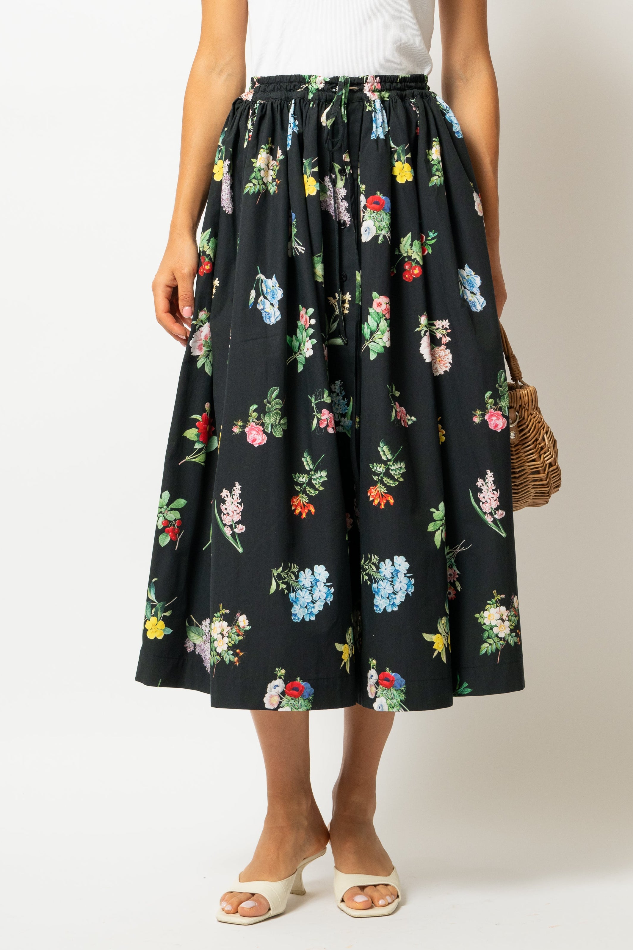 White linen midi skirt with ruffles and crocheted lace