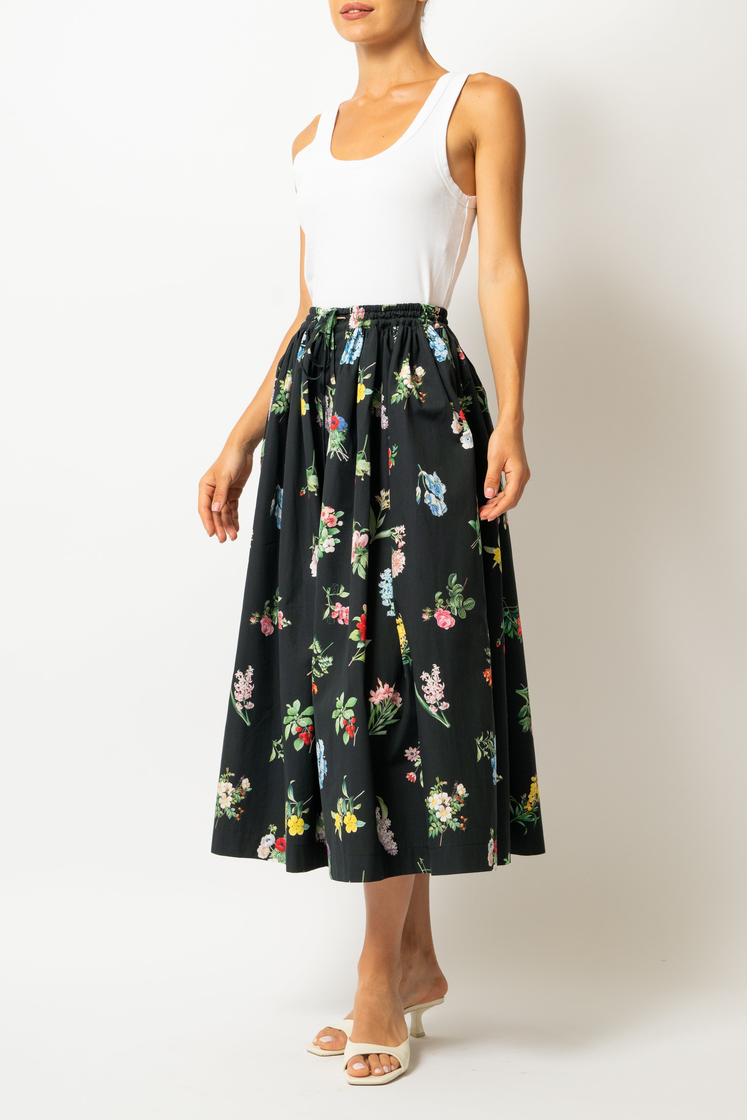 White linen midi skirt with ruffles and crocheted lace