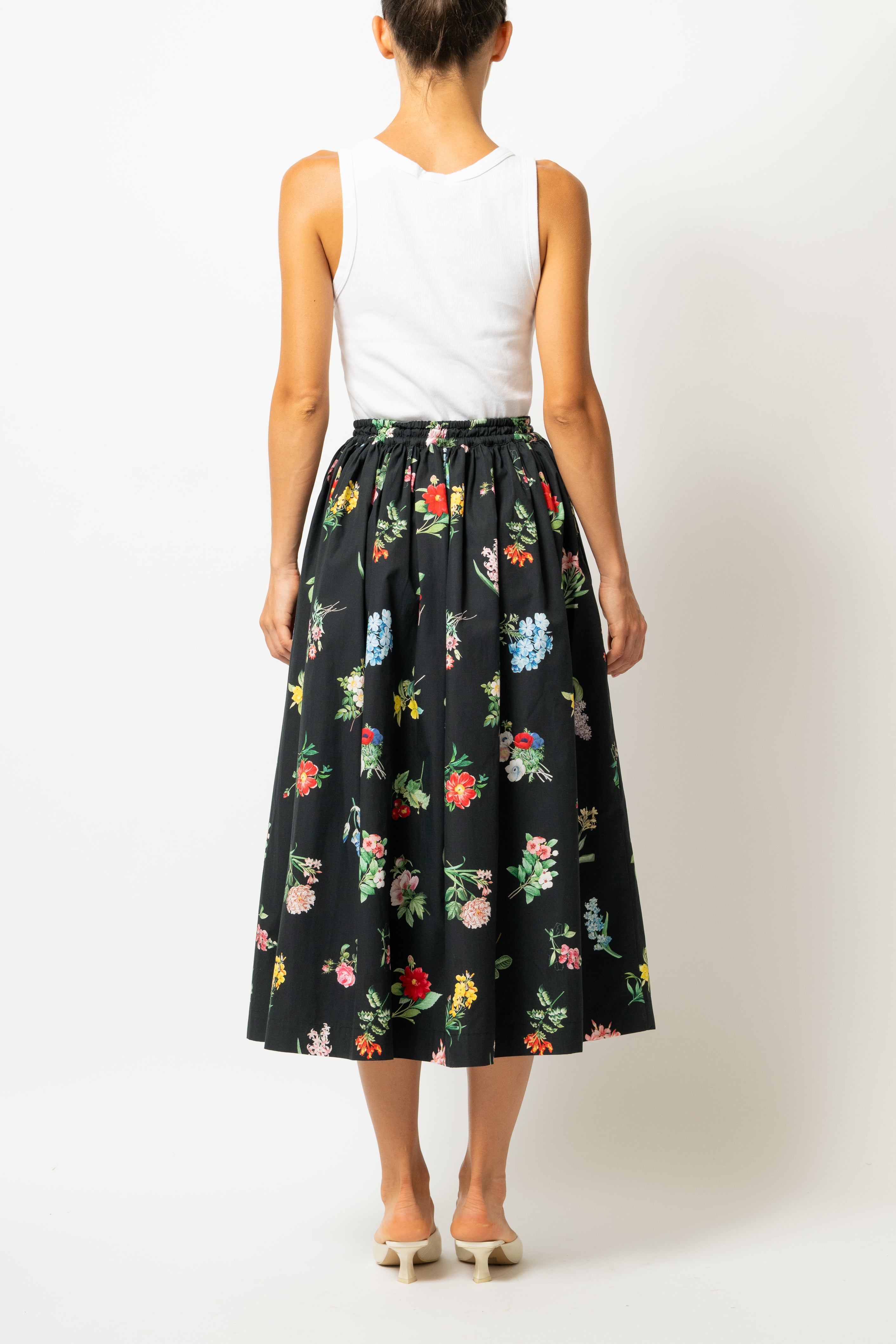 White linen midi skirt with ruffles and crocheted lace