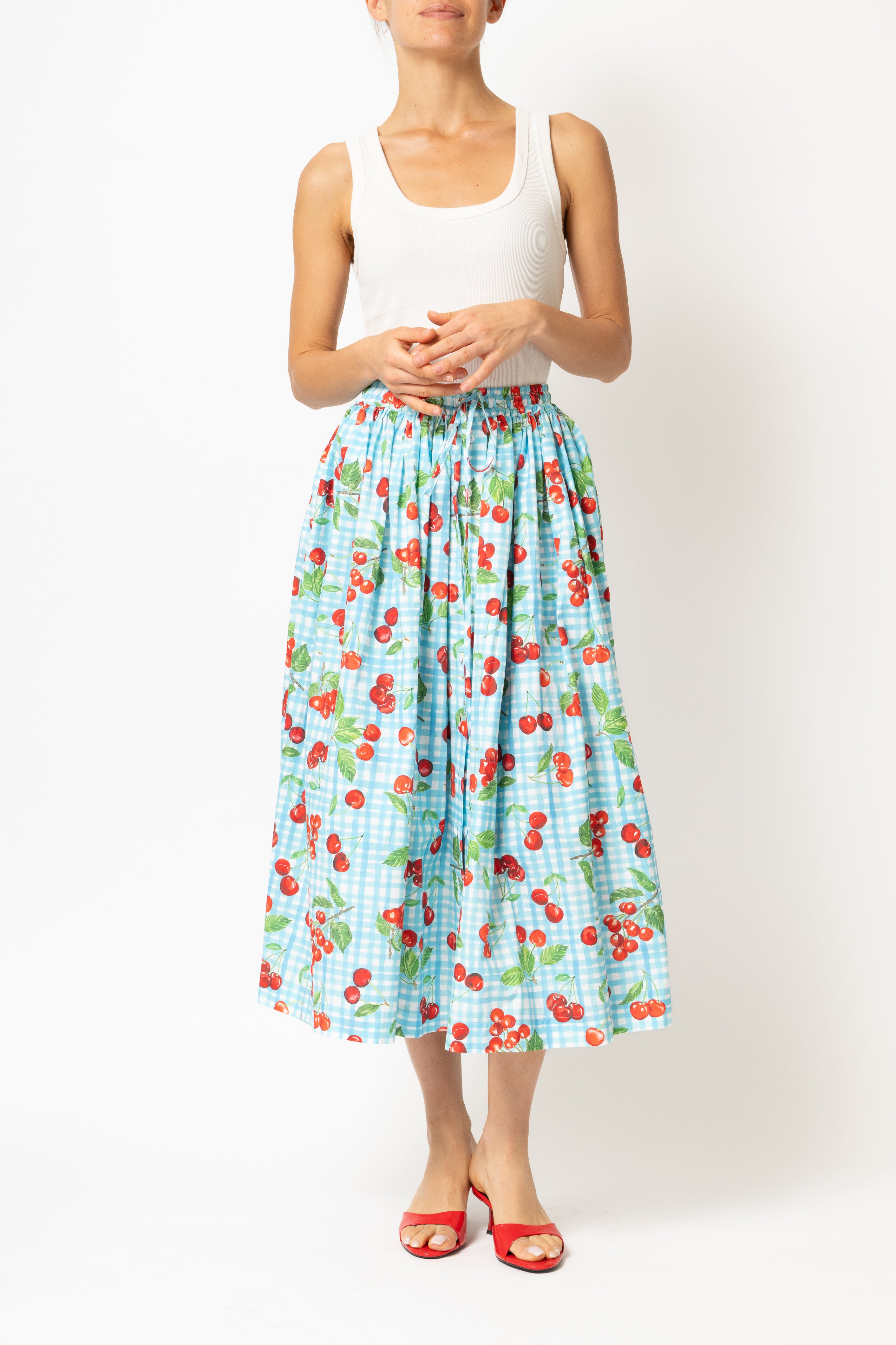 White linen midi skirt with ruffles and crocheted lace