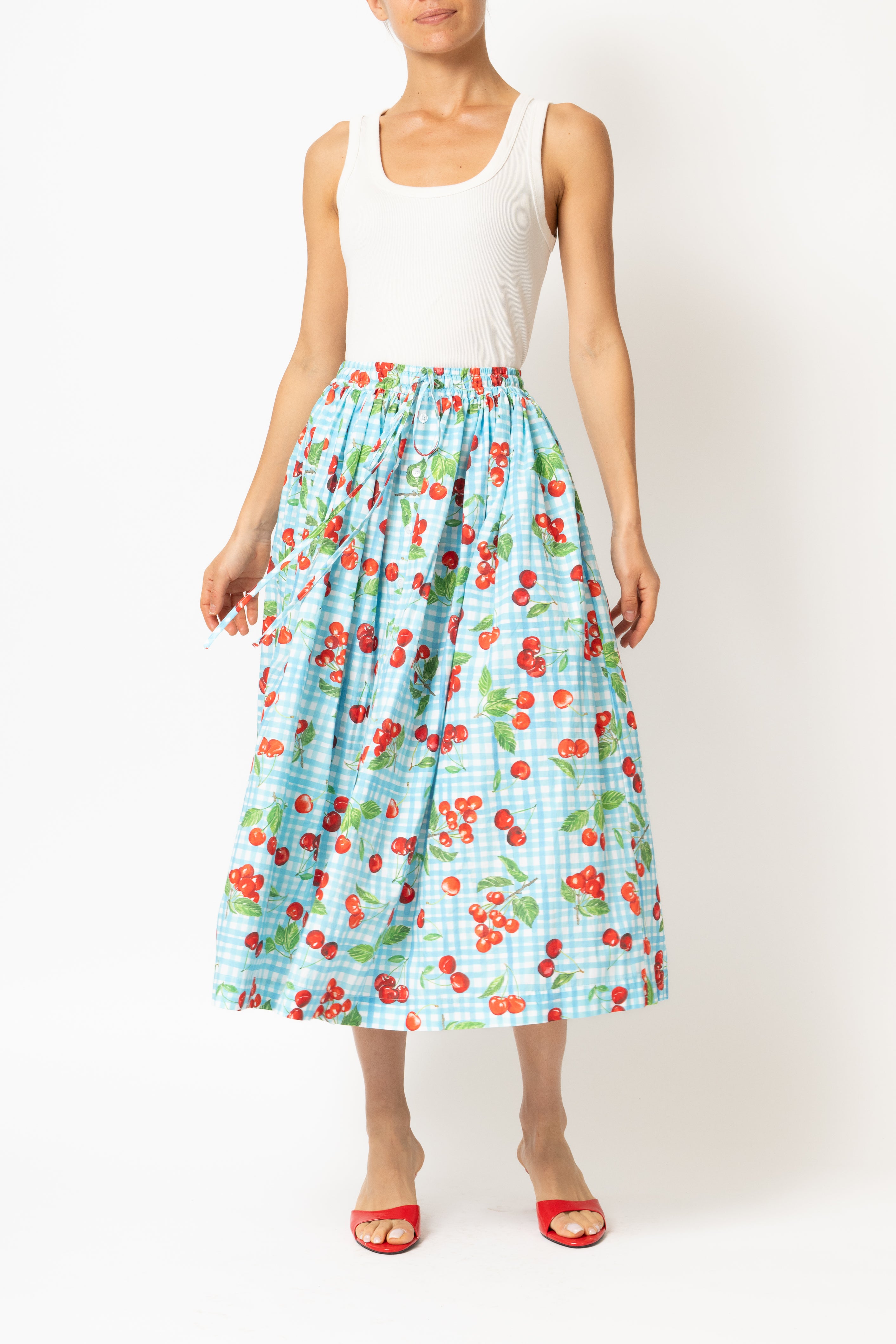 White linen midi skirt with ruffles and crocheted lace