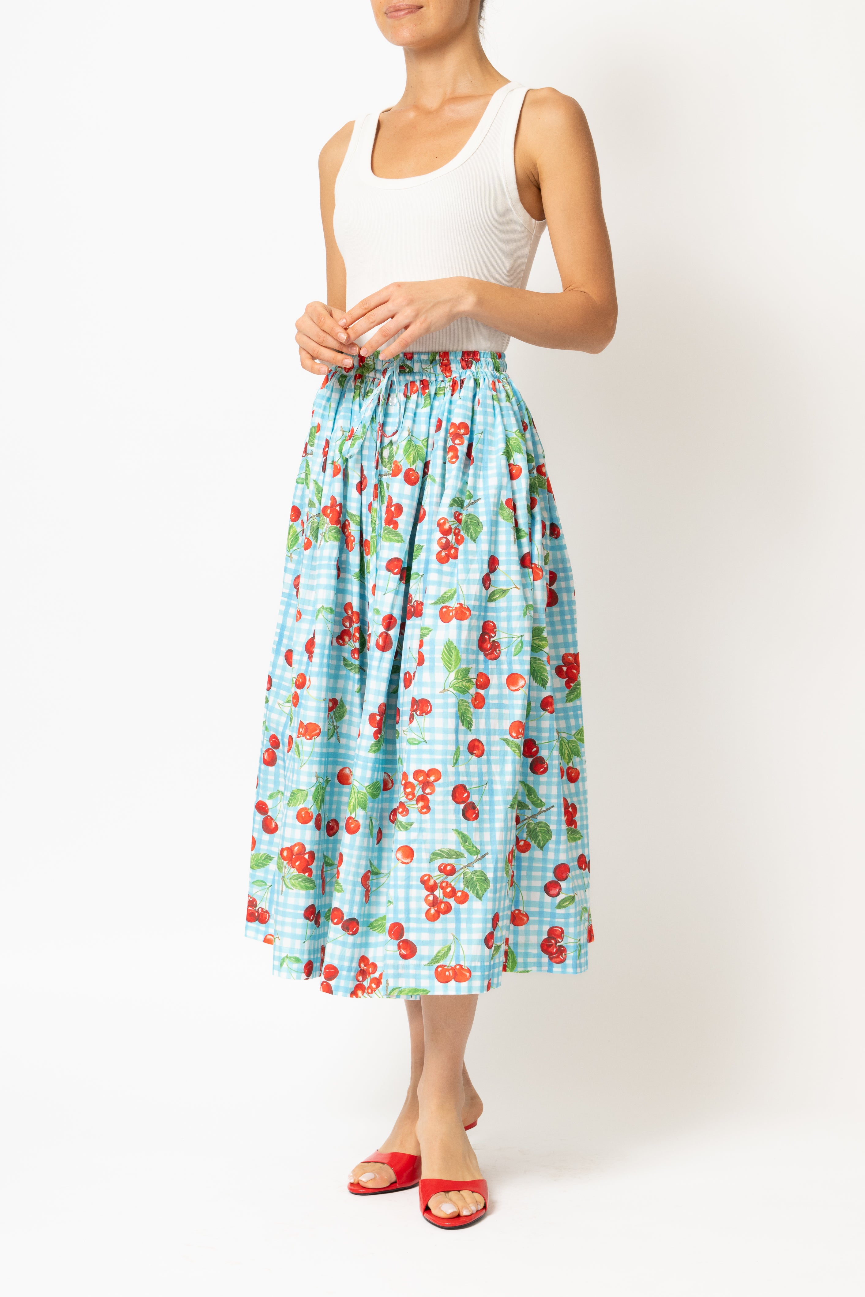 White linen midi skirt with ruffles and crocheted lace