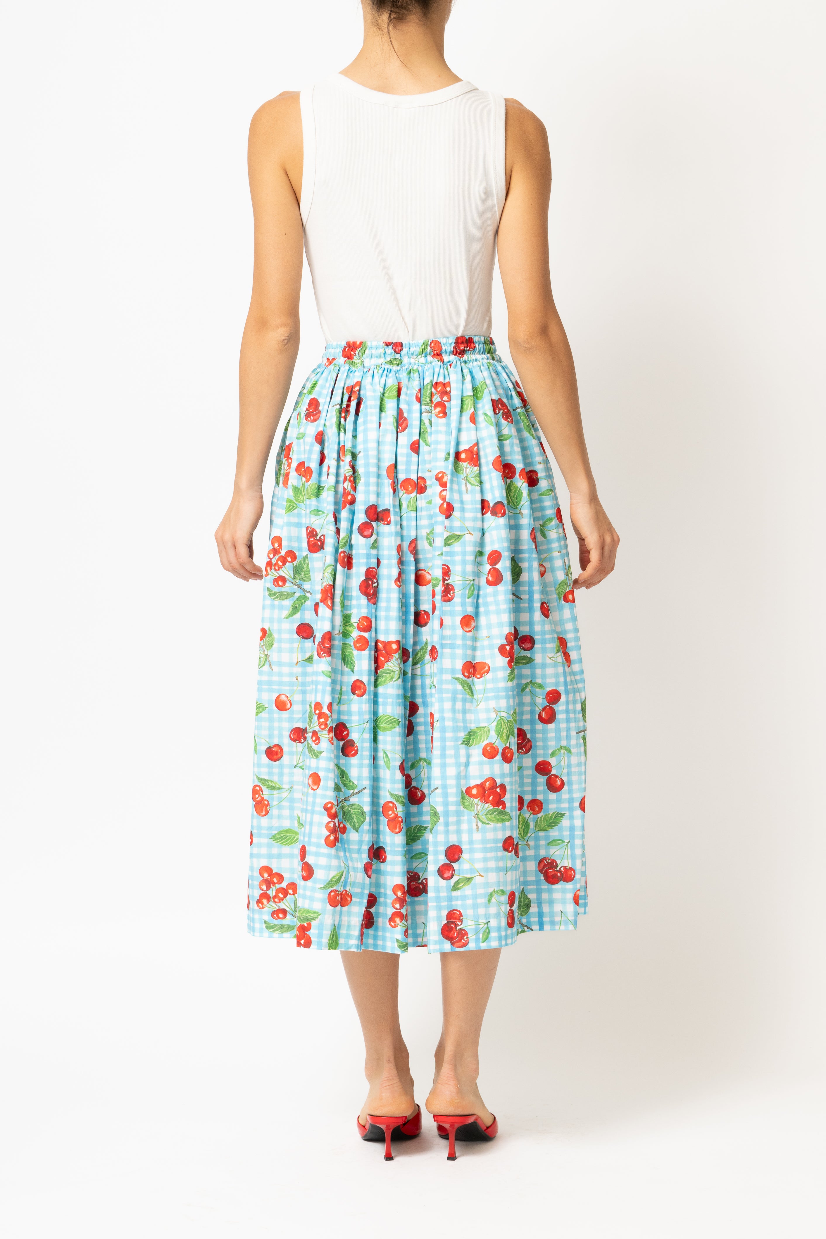 White linen midi skirt with ruffles and crocheted lace