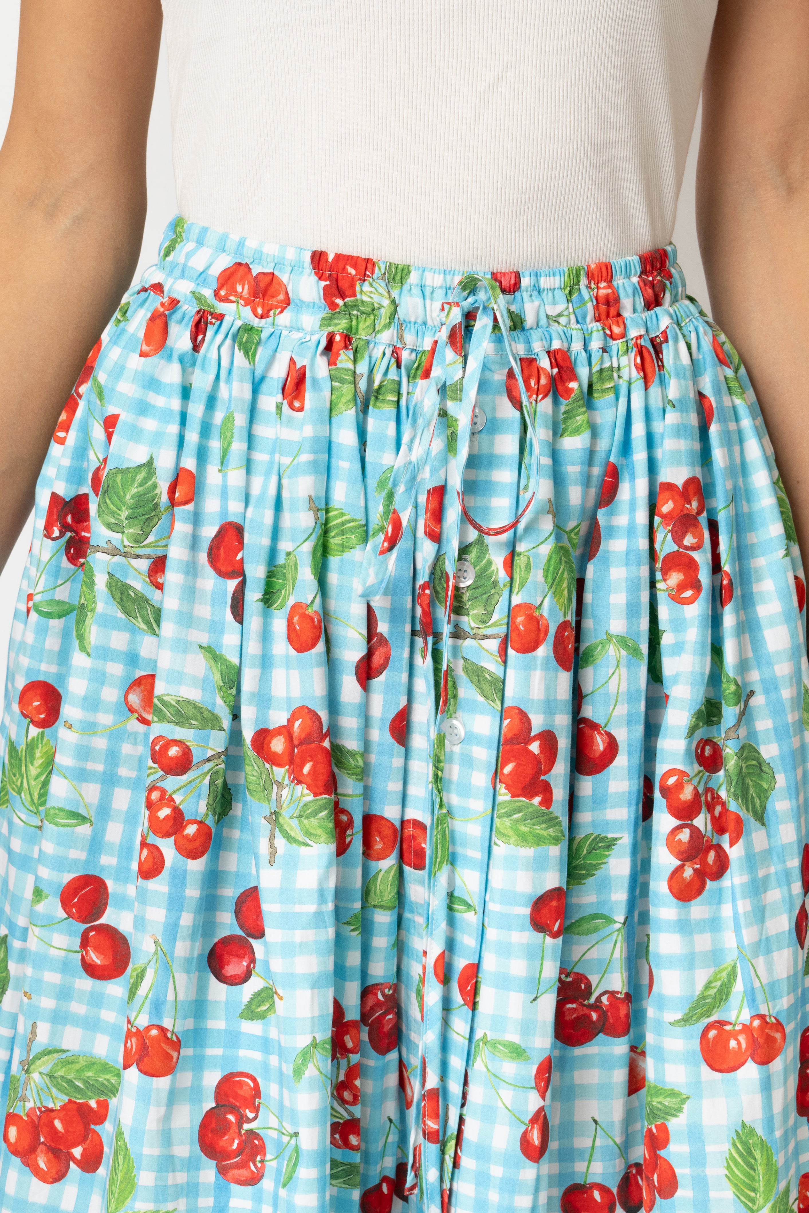 White linen midi skirt with ruffles and crocheted lace
