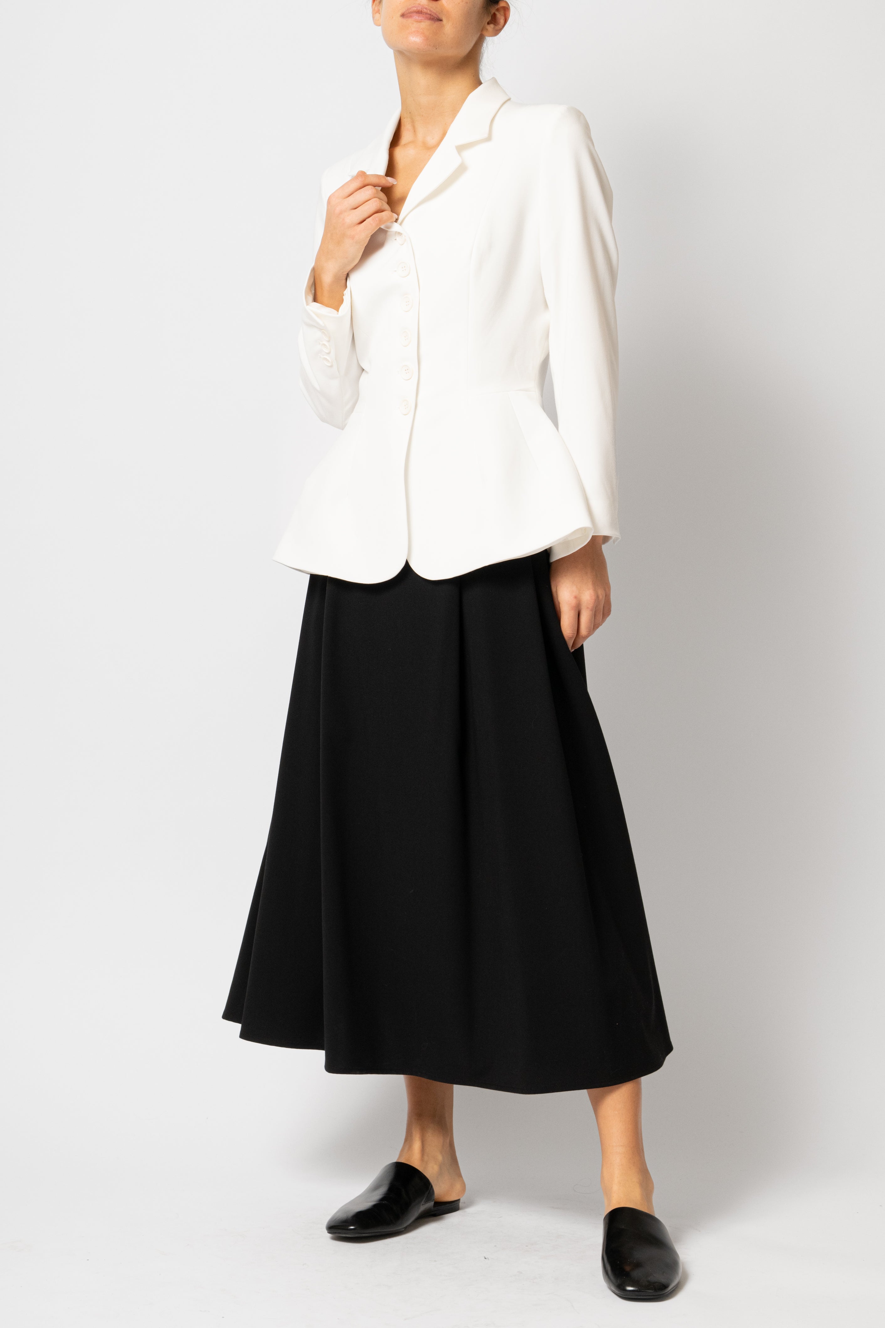Wide pleated midi skirt made of black viscose fabric