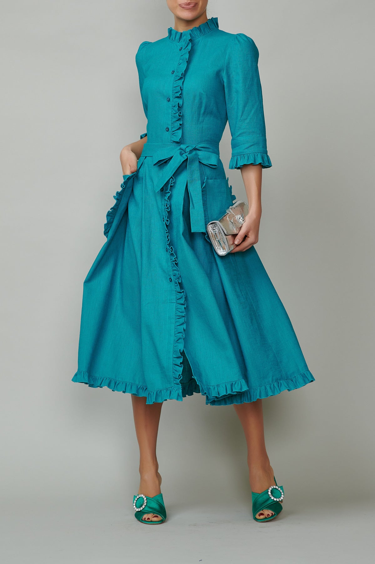 Shirt dress with applied pockets and ruffles, made of turquoise leather